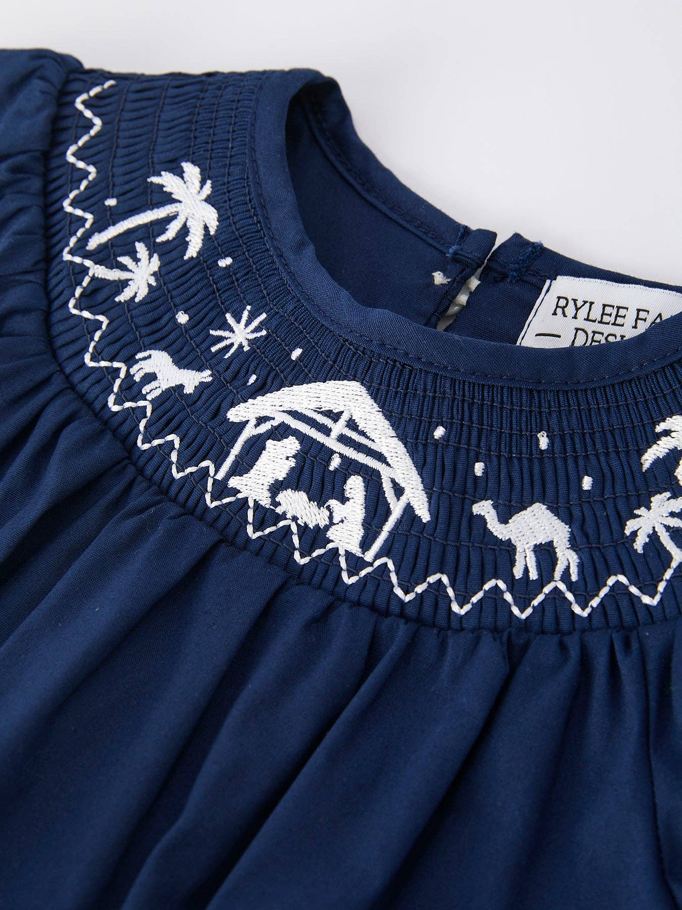 Navy Nativity Smocked Romper